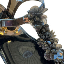 Load image into Gallery viewer, Close-up of floral detail on Chanel black jelly sandal
