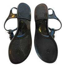 Load image into Gallery viewer, Heel and footbed detail of Chanel black floral jelly sandals
